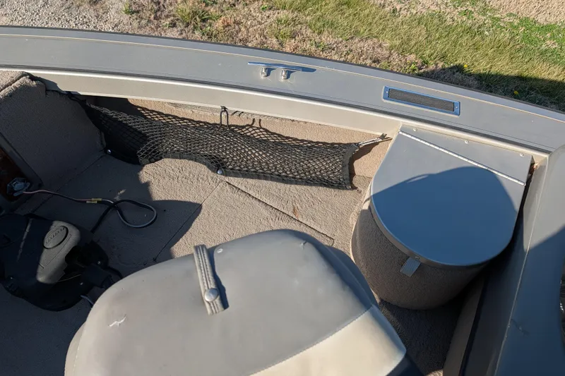 Slide: The Image of Interior of a 2003 Tracker Targa 17 SC boat showing seating and storage. - 21