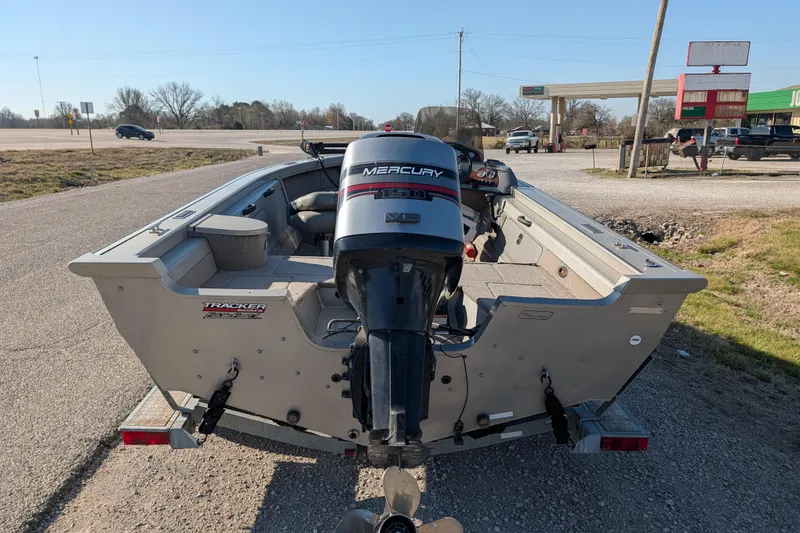 Slide: The Image of 2003 Tracker Targa 17 SC boat with Mercury outboard motor on a trailer. - 7