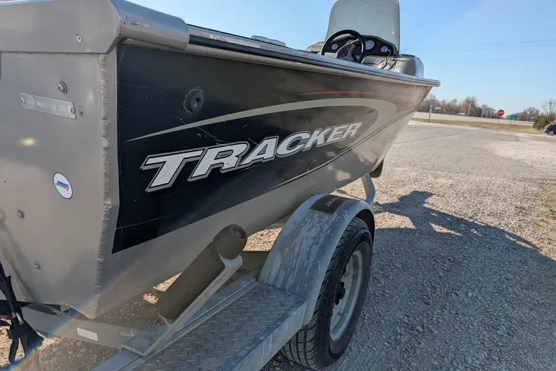 Slide: The Image of 2003 Tracker Targa 17 SC boat on trailer in outdoor setting. - 8