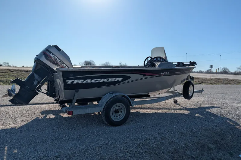 Slide: The Image of 2003 Tracker Targa 17 SC boat on trailer with Mercury outboard motor. - 9