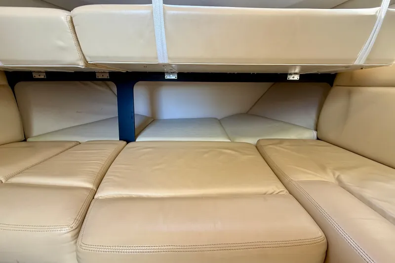 Slide: The Image of 2007 Tiara Yachts 3000 Open interior cabin with beige leather seating. - 14