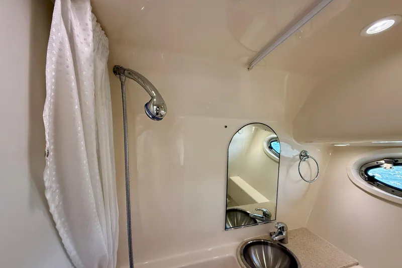 Slide: The Image of Bathroom interior of 2007 Tiara Yachts 3000 Open with shower and sink. - 22