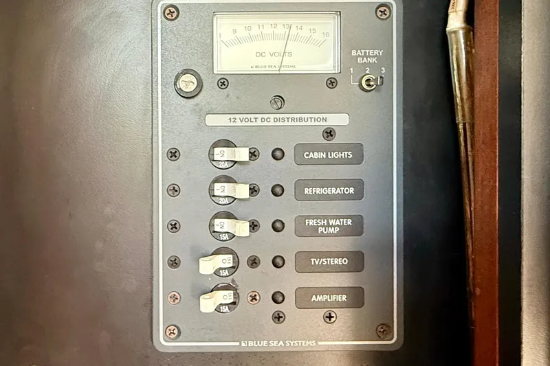 Slide: The Image of Control panel of a 2007 Tiara Yachts 3000 Open, featuring 12-volt DC distribution. - 23