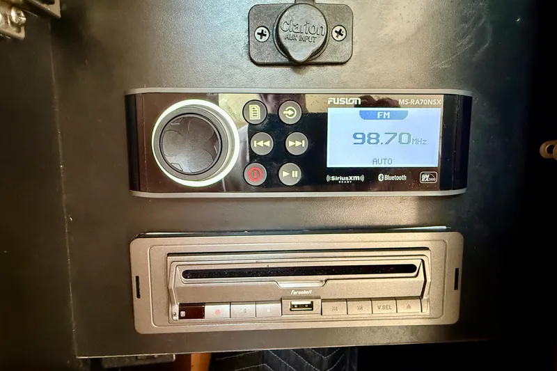 Slide: The Image of Fusion marine stereo system on a 2007 Tiara Yachts 3000 Open boat dashboard. - 24