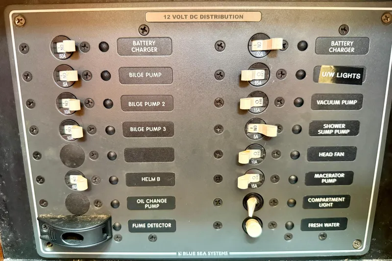 Slide: The Image of 2007 Tiara Yachts 3000 Open electrical panel with labeled switches and circuit breakers. - 26