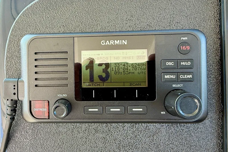 Slide: The Image of Garmin marine radio on 2007 Tiara Yachts 3000 Open dashboard, displaying channel 13. - 33
