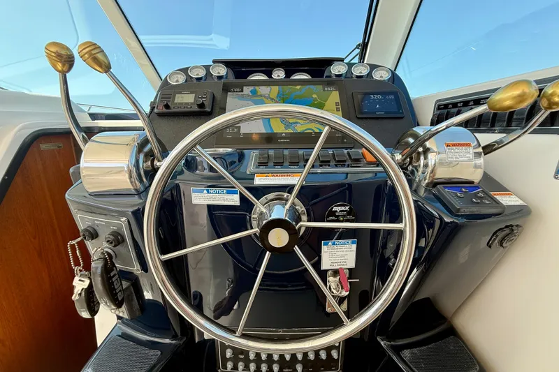 Slide: The Image of Helm of 2007 Tiara Yachts 3000 Open with navigation equipment and steering wheel. - 35