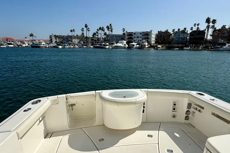 Slide: The Image of 2007 Tiara Yachts 3000 Open boat deck overlooking marina with palm trees and buildings. - 37