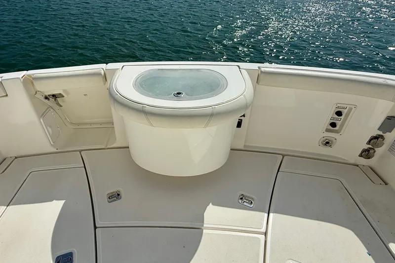 Slide: The Image of 2007 Tiara Yachts 3000 Open deck with livewell, overlooking sparkling water. - 39