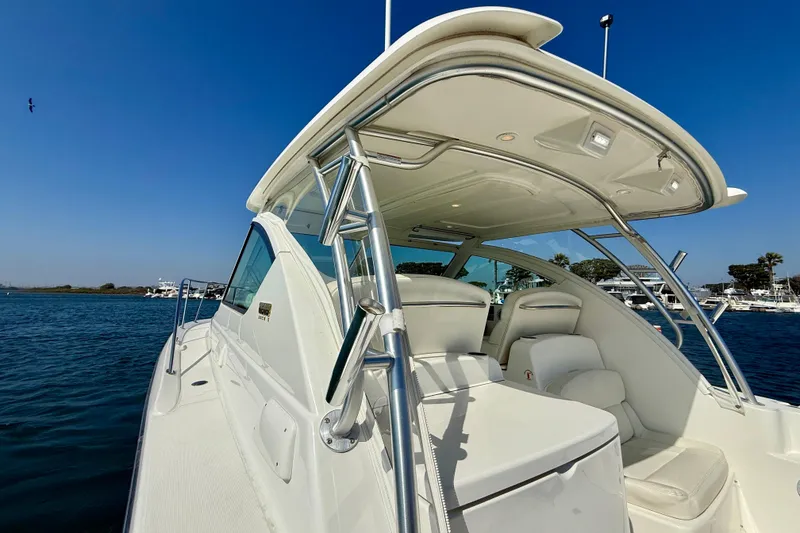 Slide: The Image of 2007 Tiara Yachts 3000 Open on water, showcasing sleek design and spacious seating. - 44