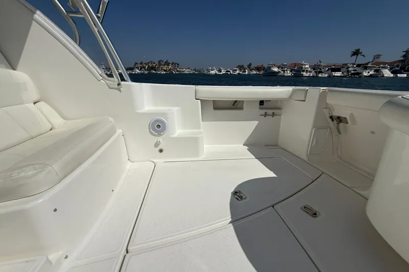 Slide: The Image of 2007 Tiara Yachts 3000 Open boat interior with white seating and ocean view. - 49