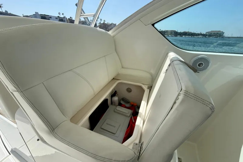 Slide: The Image of 2007 Tiara Yachts 3000 Open interior with storage compartment under seat. - 53