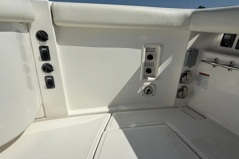 Slide: The Image of 2007 Tiara Yachts 3000 Open cockpit controls and seating area in bright sunlight. - 56