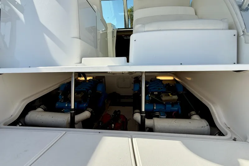 Slide: The Image of Engine compartment of a 2007 Tiara Yachts 3000 Open, showcasing dual engines. - 58