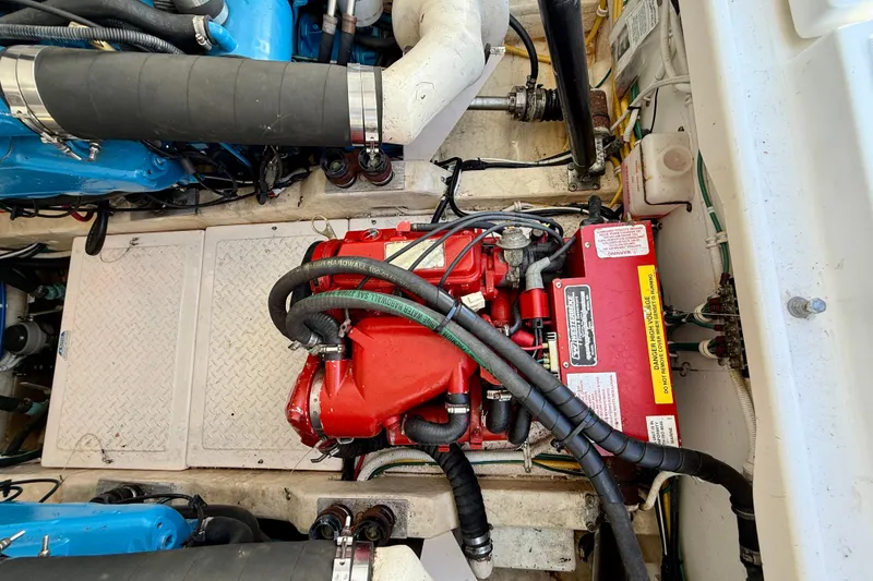 Slide: The Image of Engine compartment of a 2007 Tiara Yachts 3000 Open, featuring detailed mechanical components. - 60
