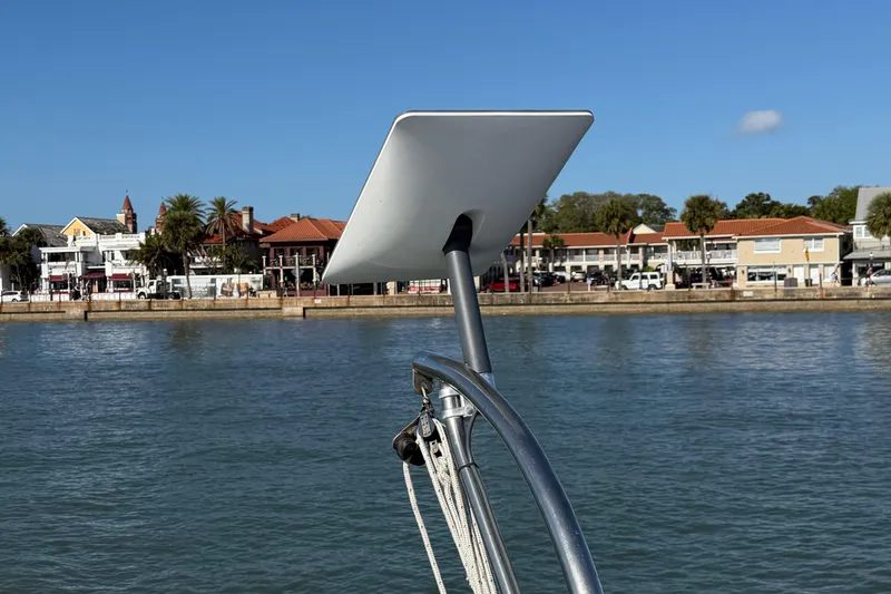 Slide: The Image of Starlink satellite dish on 2009 Nautitech 47 catamaran, with coastal town in background. - 100
