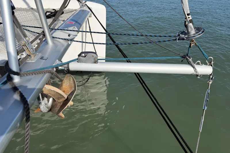 Slide: The Image of Nautitech 47 catamaran bow with anchor and rigging, 2009 model, on calm water. - 102