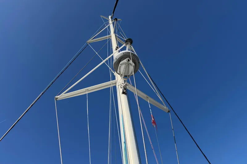 Slide: The Image of Mast of a 2009 Nautitech 47 catamaran against a clear blue sky. - 103