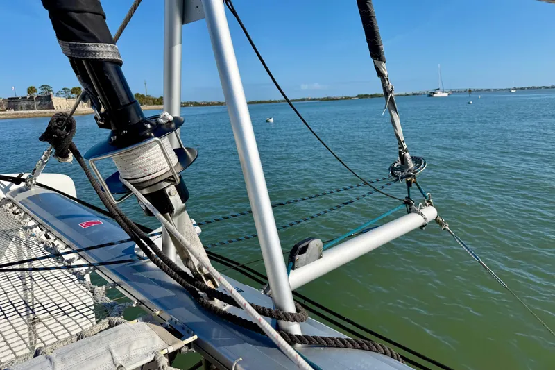 Slide: The Image of Nautitech 47 catamaran rigging detail, 2009 model, on calm waters under clear blue sky. - 106