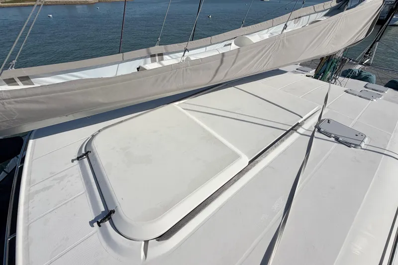 Slide: The Image of Nautitech 47 catamaran deck view, showcasing sleek design and sail details, 2009 model. - 111