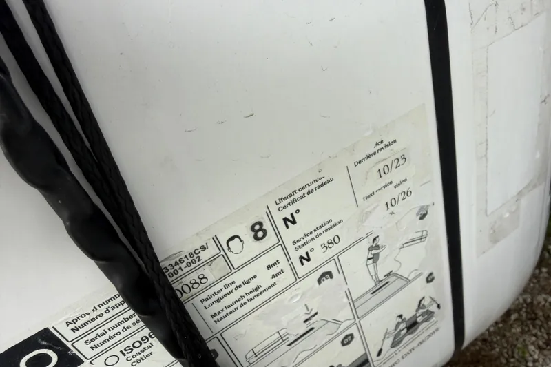 Slide: The Image of Close-up of Nautitech 47 (2009) boat label with safety instructions and revision dates. - 114
