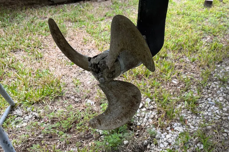 Slide: The Image of Propeller of a 2009 Nautitech 47 catamaran on grassy ground. - 120