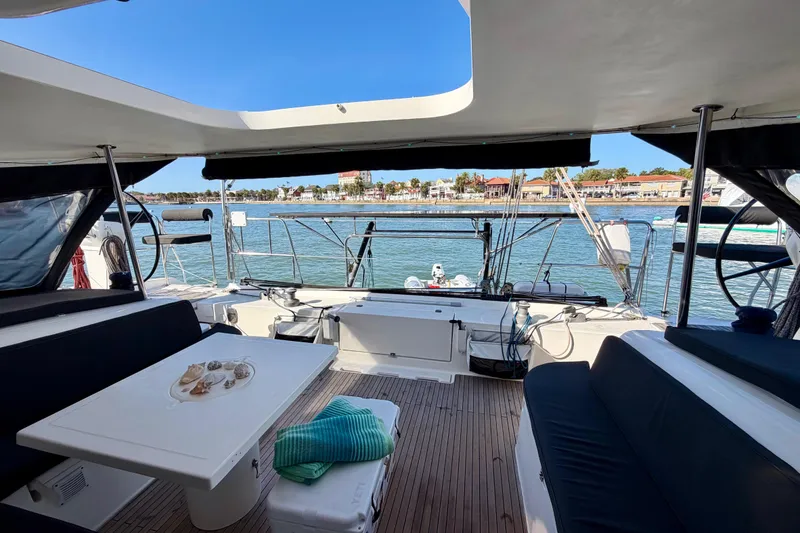 Slide: The Image of Spacious deck of 2009 Nautitech 47 catamaran with waterfront view and comfortable seating. - 15