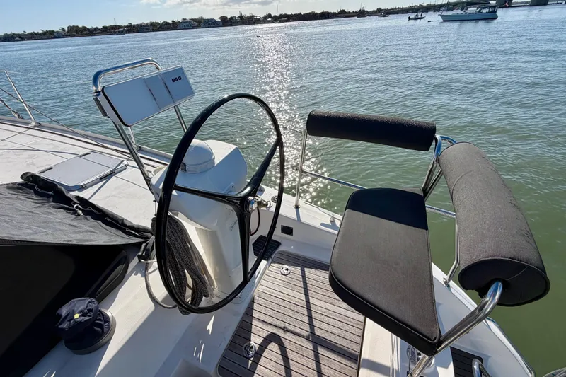 Slide: The Image of Steering area of a 2009 Nautitech 47 catamaran on calm waters. - 27