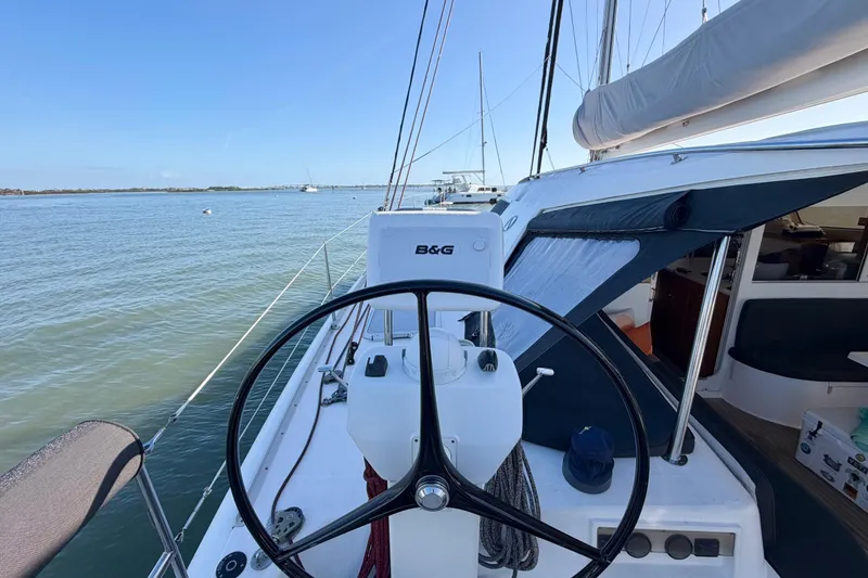 Slide: The Image of Steering wheel of 2009 Nautitech 47 catamaran on calm waters. - 33