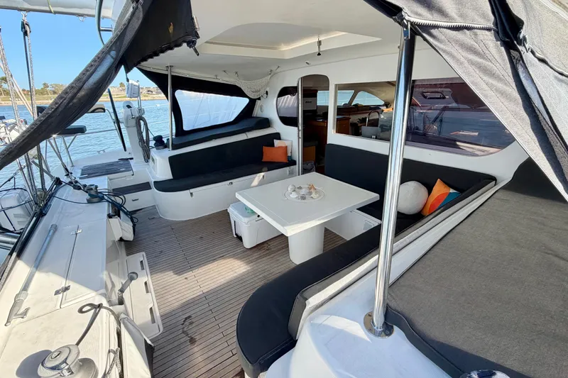 Slide: The Image of Spacious Nautitech 47 catamaran cockpit with comfortable seating and table, 2009 model. - 35