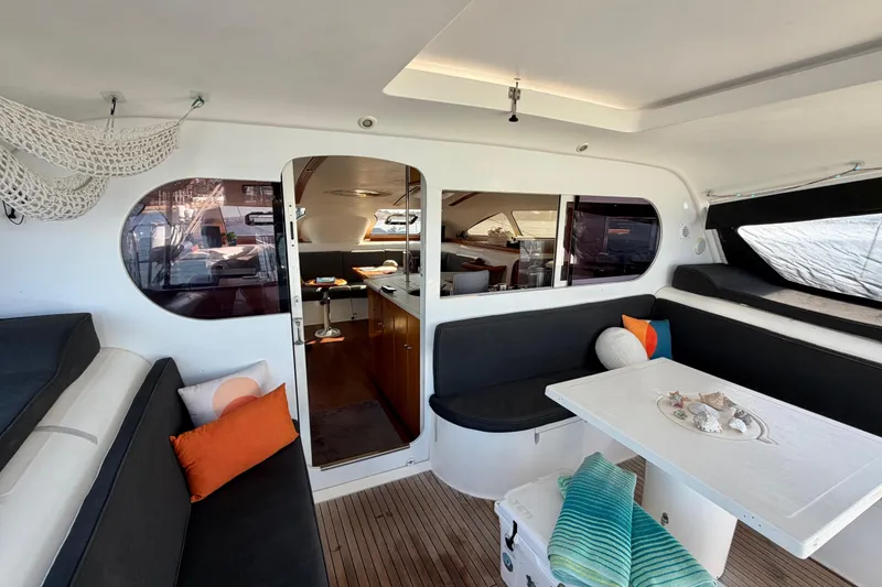 Slide: The Image of Interior of 2009 Nautitech 47 catamaran with cozy seating and decorative pillows. - 37