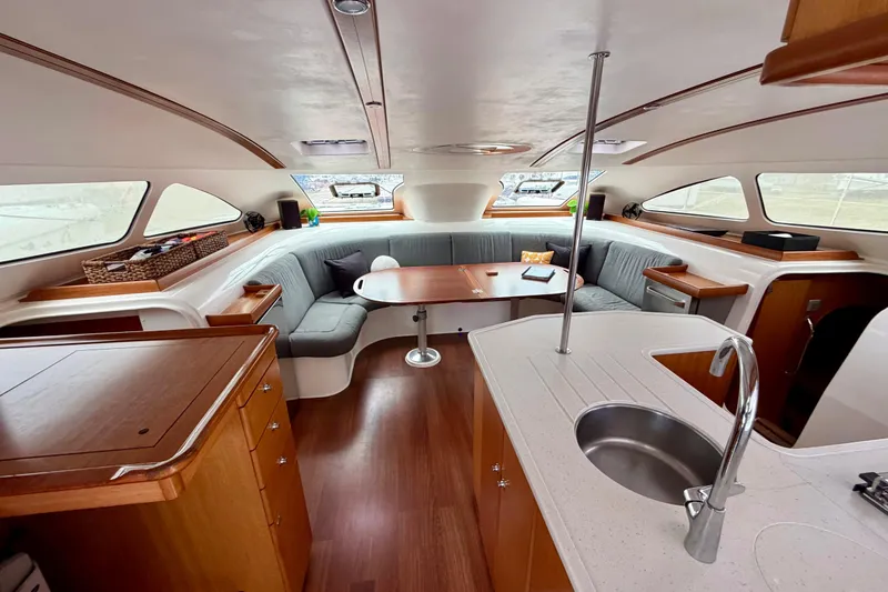 Slide: The Image of Luxurious interior of a 2009 Nautitech 47 catamaran with modern kitchen and seating area. - 40