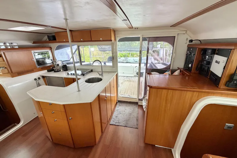 Slide: The Image of Interior of 2009 Nautitech 47 yacht with modern kitchen and wooden cabinetry. - 41