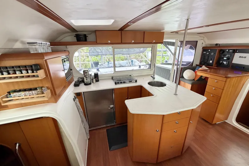 Slide: The Image of Luxurious 2009 Nautitech 47 yacht interior with modern kitchen and wooden cabinetry. - 42