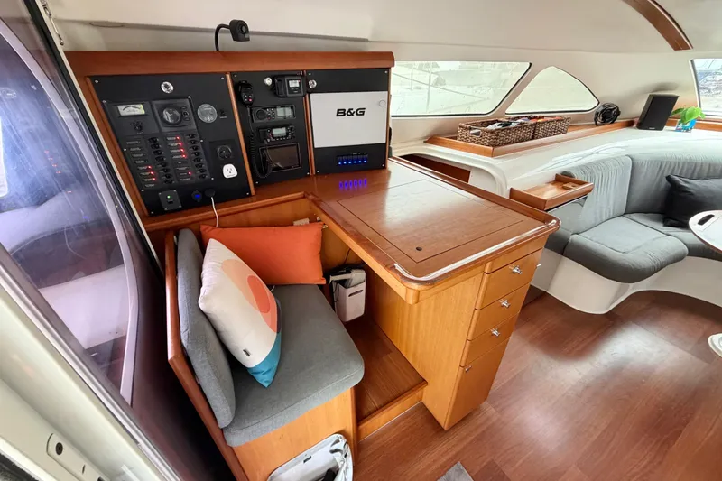 Slide: The Image of Interior of 2009 Nautitech 47 yacht with navigation panel and cozy seating area. - 44