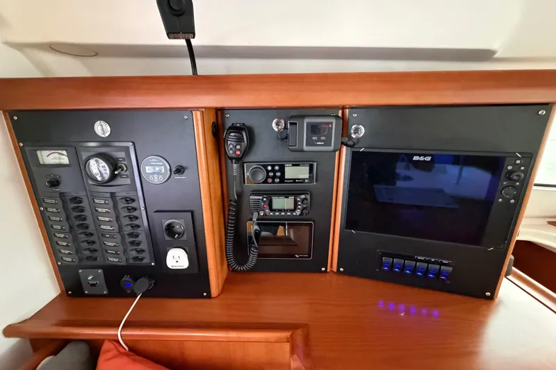 Slide: The Image of Control panel of a 2009 Nautitech 47 yacht with navigation and communication equipment. - 45