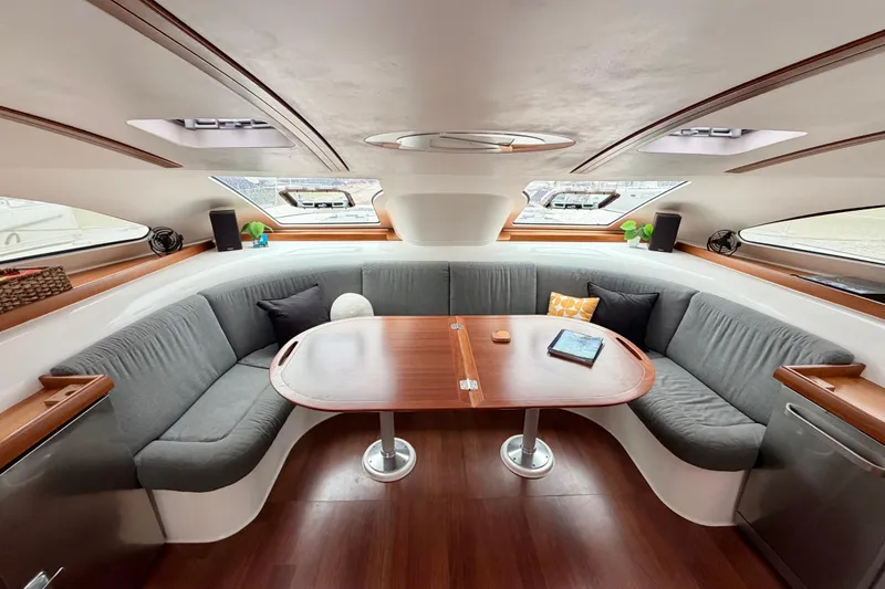 Slide: The Image of Luxurious interior of a 2009 Nautitech 47 catamaran with elegant seating and wooden table. - 46