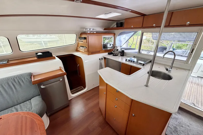 Slide: The Image of Spacious interior of 2009 Nautitech 47 catamaran with modern kitchen and seating area. - 50