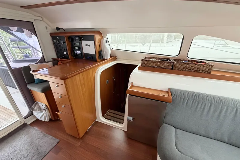 Slide: The Image of Interior of 2009 Nautitech 47 yacht with navigation station and seating area. - 51