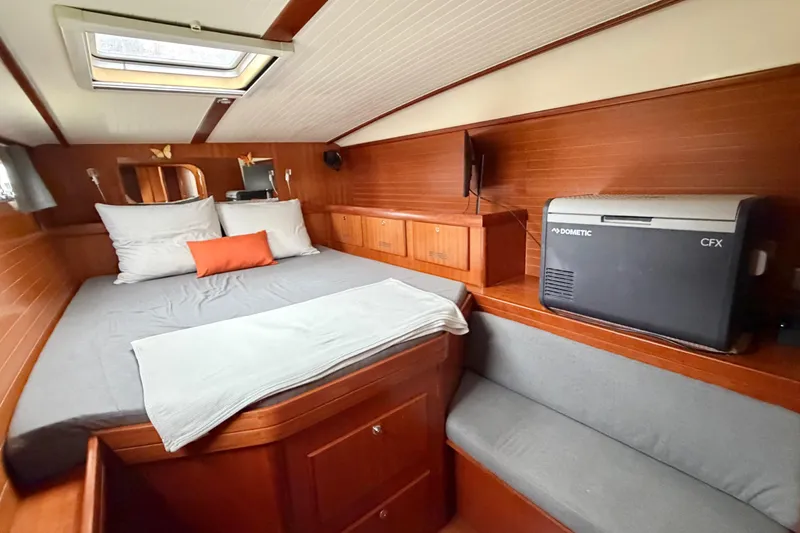 Slide: The Image of Cozy cabin interior of 2009 Nautitech 47 catamaran with bed and storage. - 54