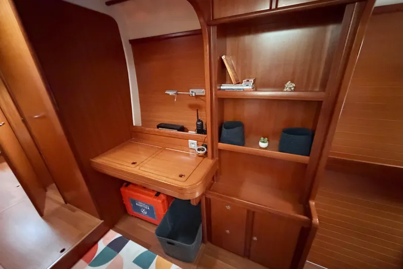 Slide: The Image of Interior of 2009 Nautitech 47 yacht with wooden shelves and desk area. - 57