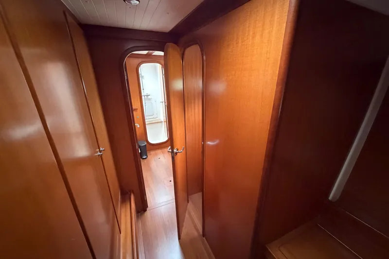 Slide: The Image of Nautitech 47 yacht interior hallway with wooden paneling, 2009 model. - 58