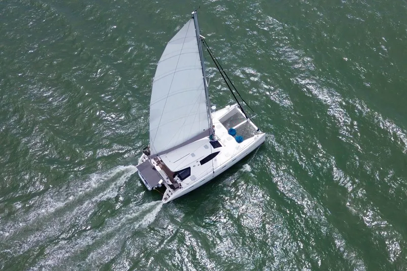 Slide: The Image of Aerial view of 2009 Nautitech 47 catamaran sailing on open water. - 6