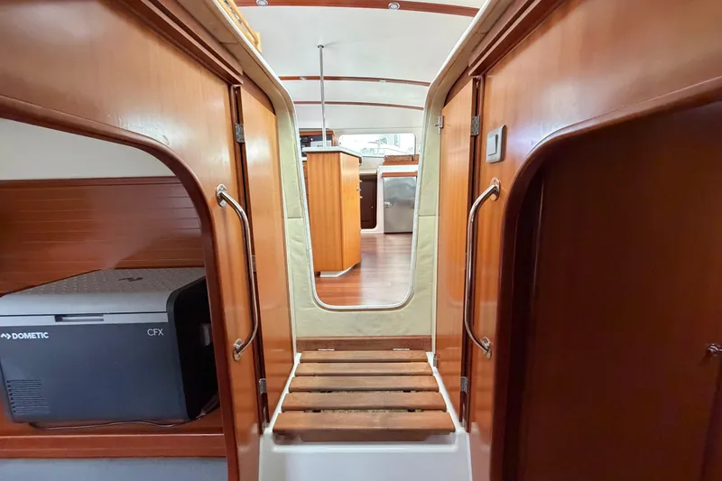Slide: The Image of Interior view of 2009 Nautitech 47 catamaran with wooden finishes and compact design. - 67