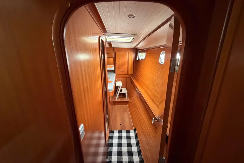 Slide: The Image of Interior of 2009 Nautitech 47 yacht with wooden paneling and cozy cabin space. - 69