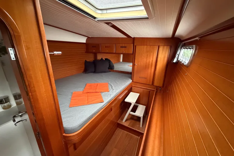 Slide: The Image of Cozy cabin interior of 2009 Nautitech 47 yacht with wooden paneling and skylight. - 70