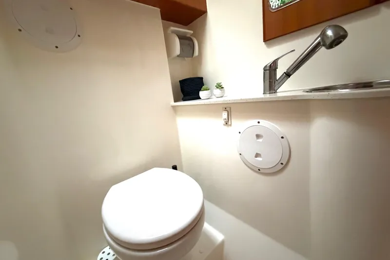 Slide: The Image of Bathroom interior of 2009 Nautitech 47 yacht with toilet and sink. - 77