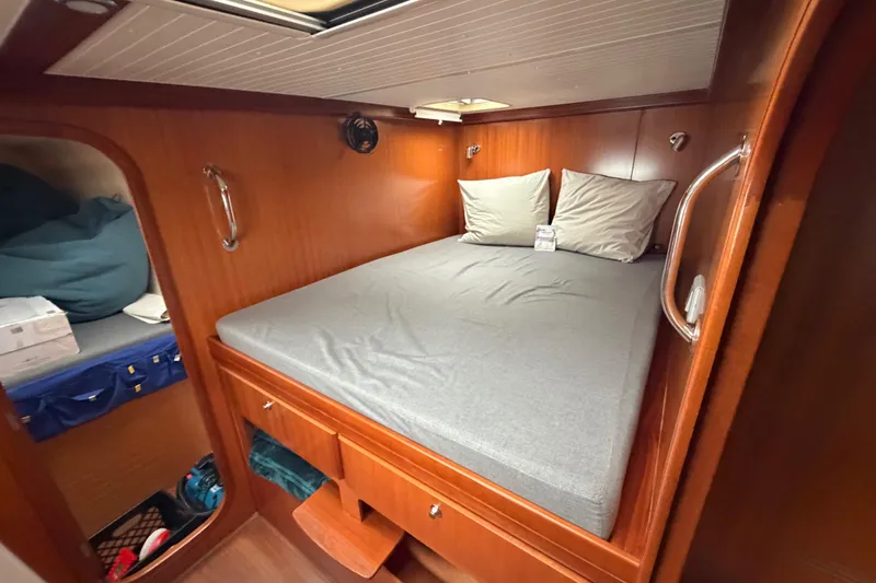 Slide: The Image of Cozy cabin interior of 2009 Nautitech 47 catamaran with wooden finish and comfortable bedding. - 79