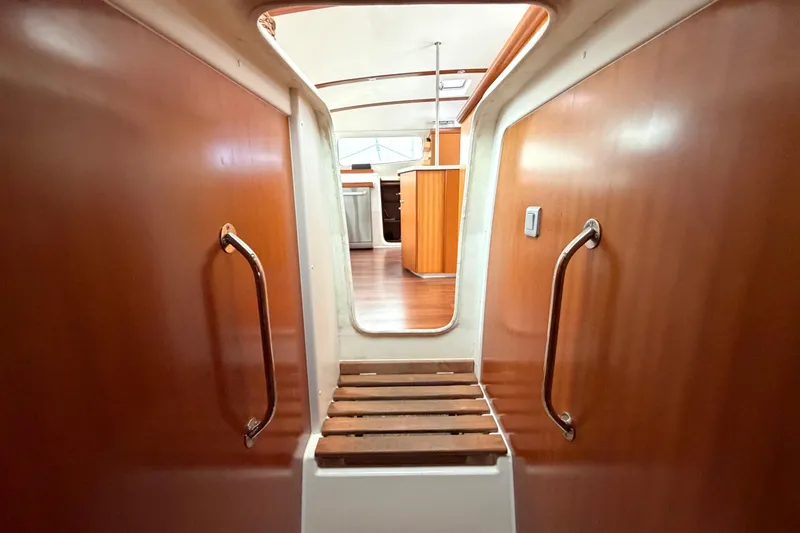 Slide: The Image of Interior view of 2009 Nautitech 47 catamaran, featuring wooden walls and sleek design. - 81