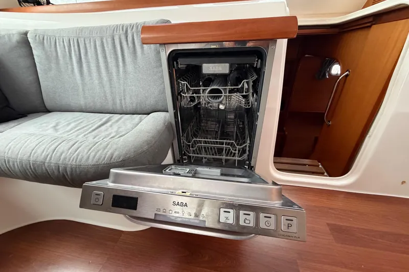 Slide: The Image of Interior of a 2009 Nautitech 47 yacht featuring a built-in Saba dishwasher. - 82
